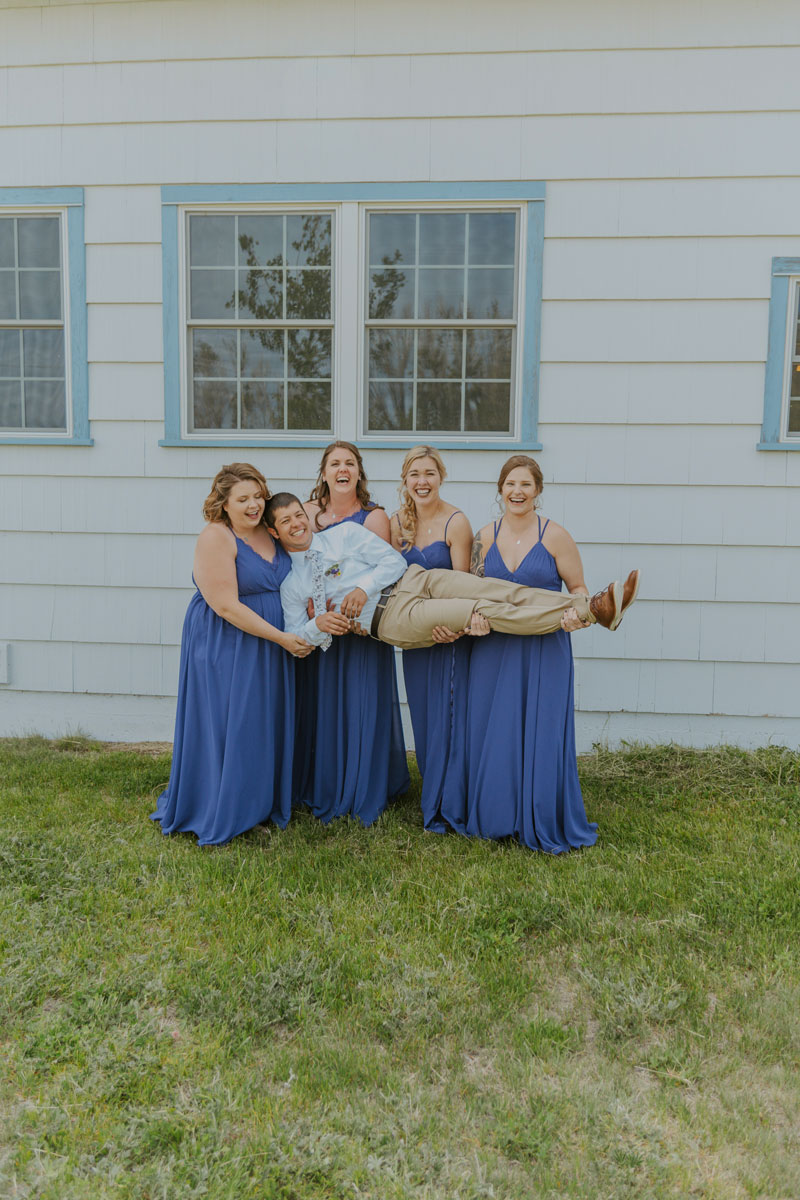 Bridal Party Poses with Groom