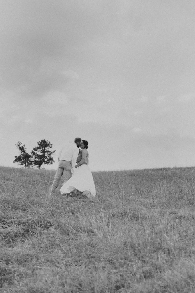 Black and White Photo of Couple Kissing Before Eloping in Wyoming