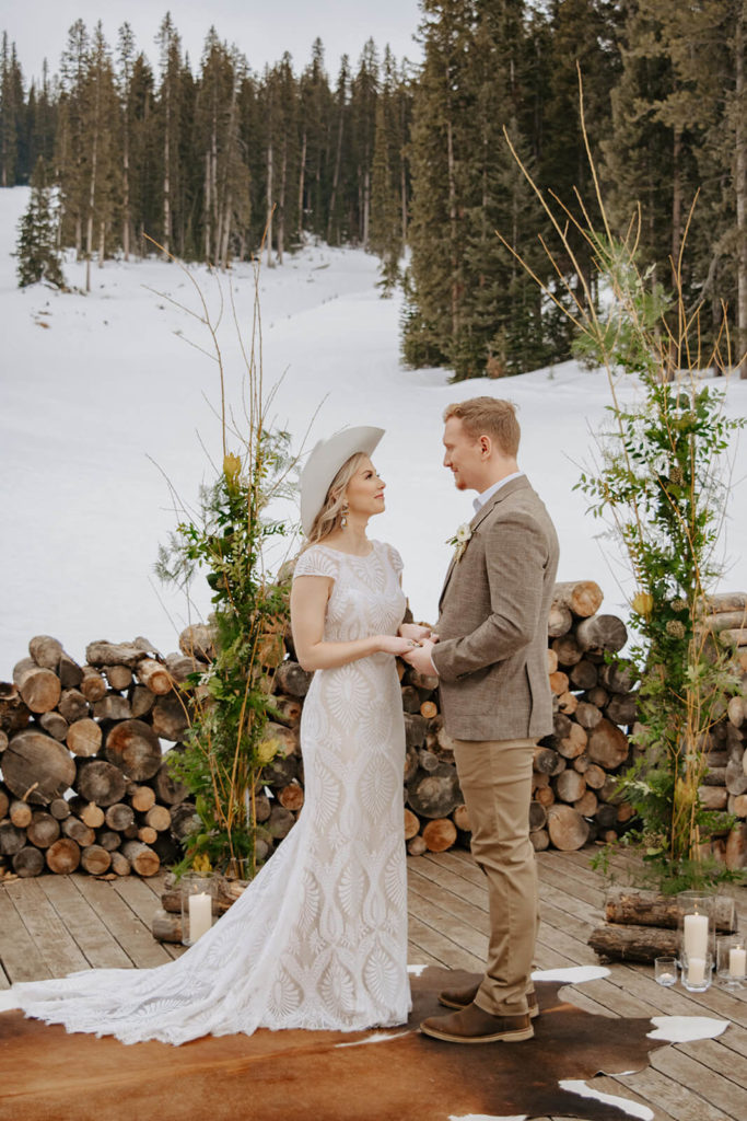 Bride and Groom Exchange Vows during Cozy Winter Wedding