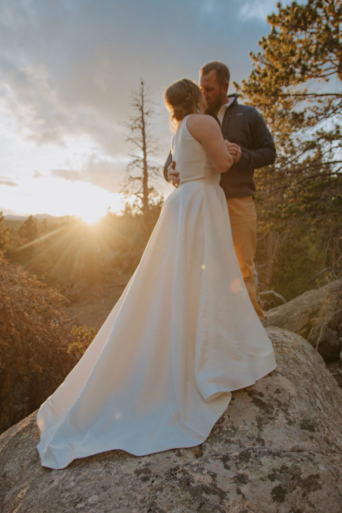 Bride and Groom Kiss During Mountain Wedding