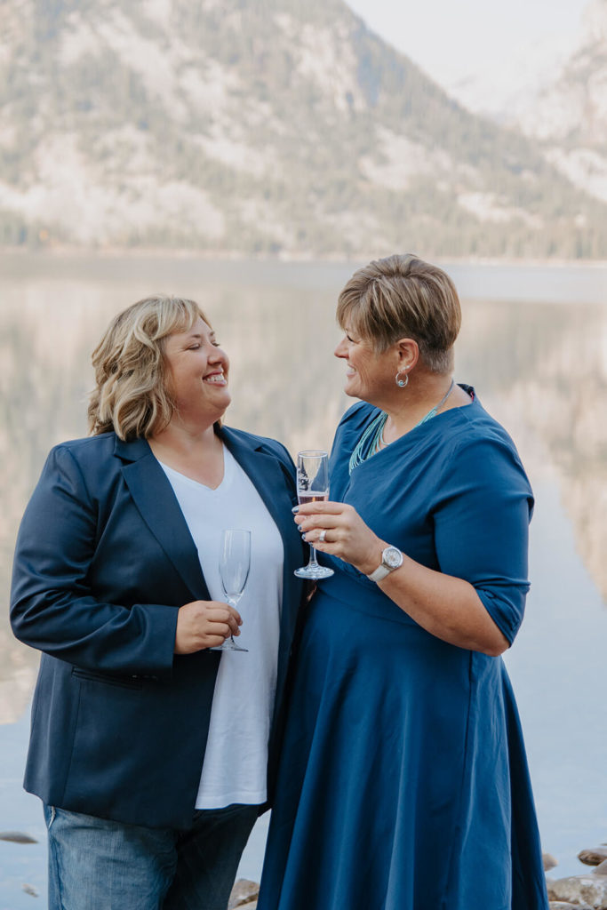 Couple Laughs While Drinking Wine in Tetons