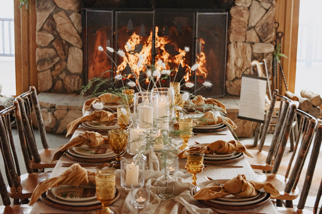 winter wedding table with fireplace in background