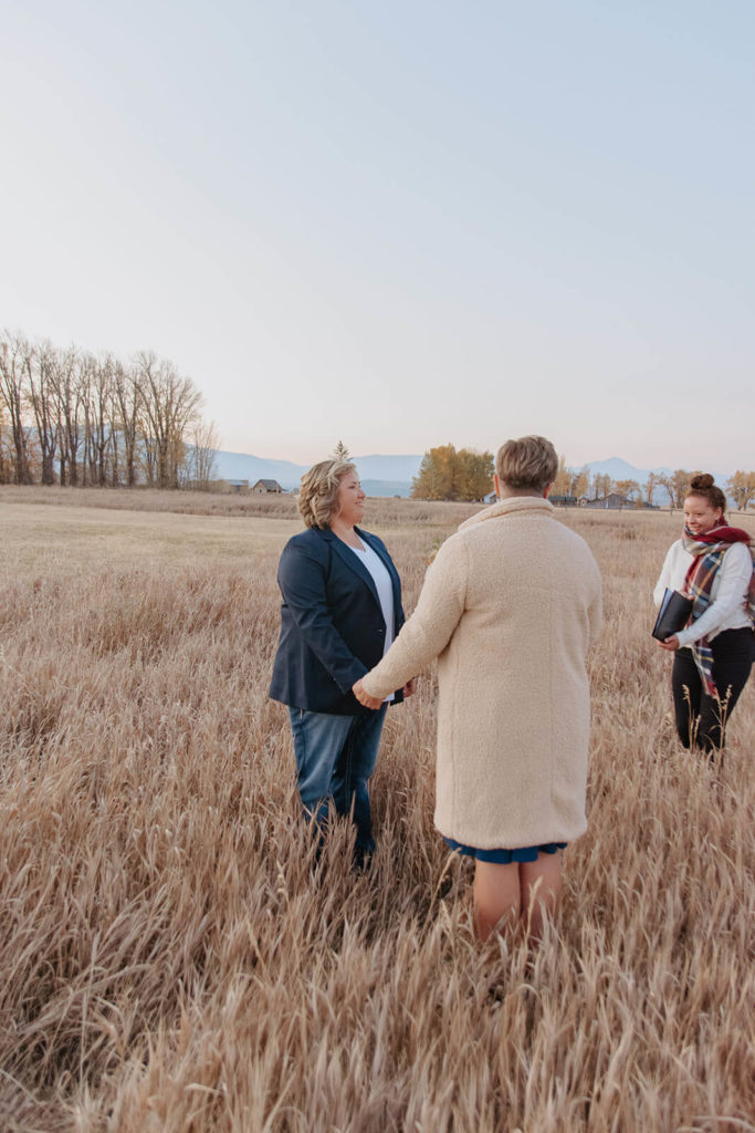 Couple hold hands during Elopement Ceremony