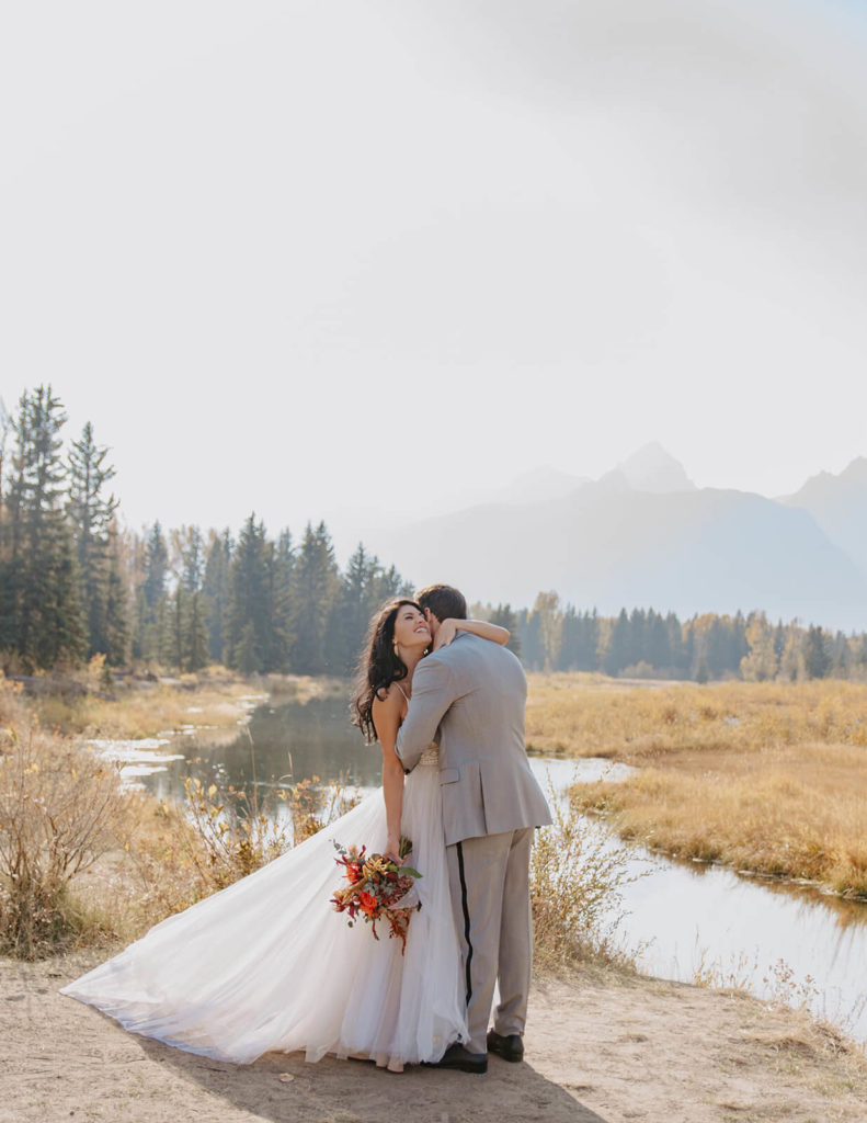 Rachel and Clay Hug After Eloping below the Teton Mountains