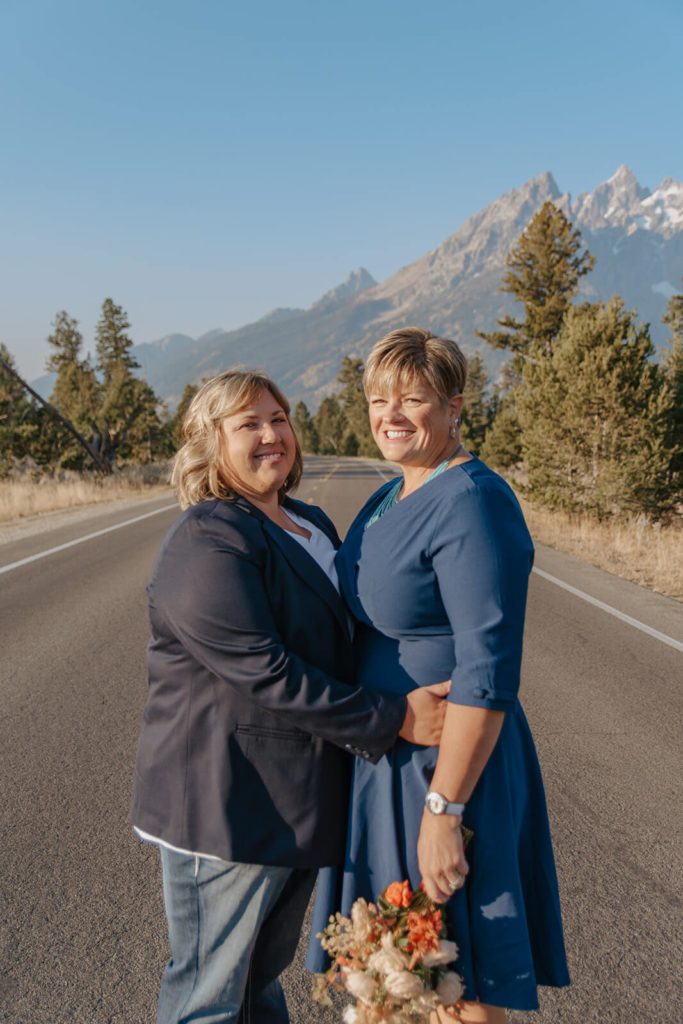 Haley and Beth Portrait on Road with Tetons in Background