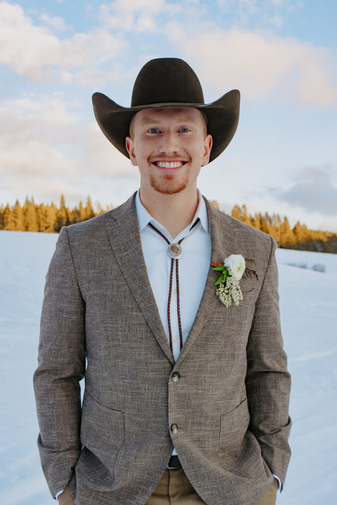 Groom Smiling at Cozy Winter Wedding in Buffalo Wyoming