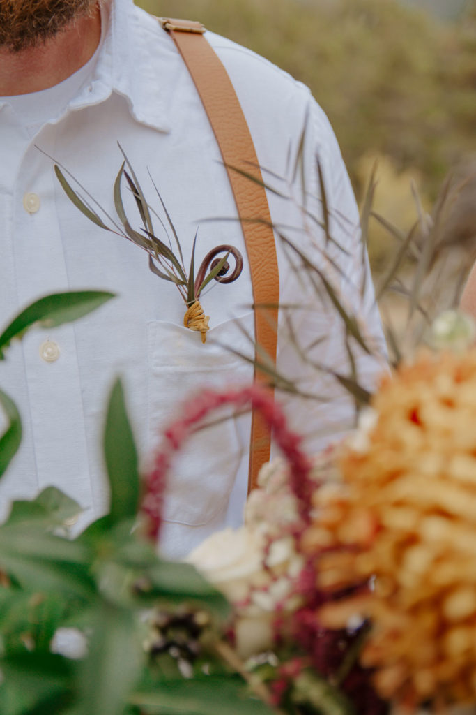 Groom Outfit Details During Outdoor Elopement