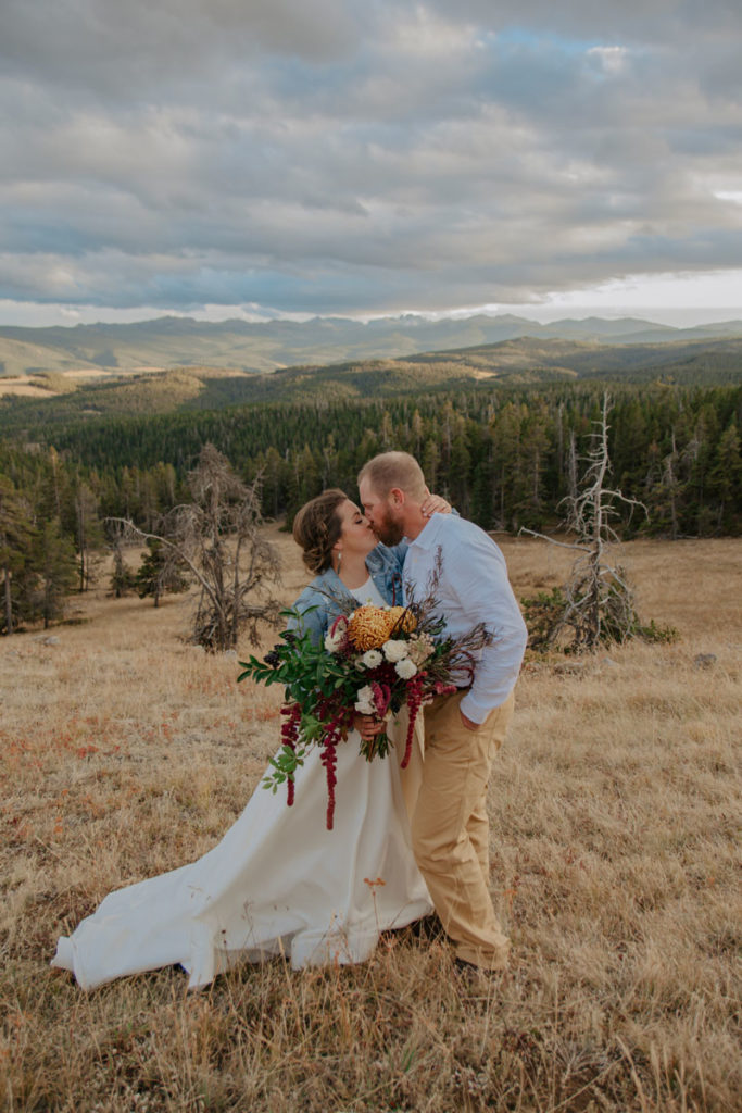 Bride and Groom Kiss During Fall Wedding in Wyoming