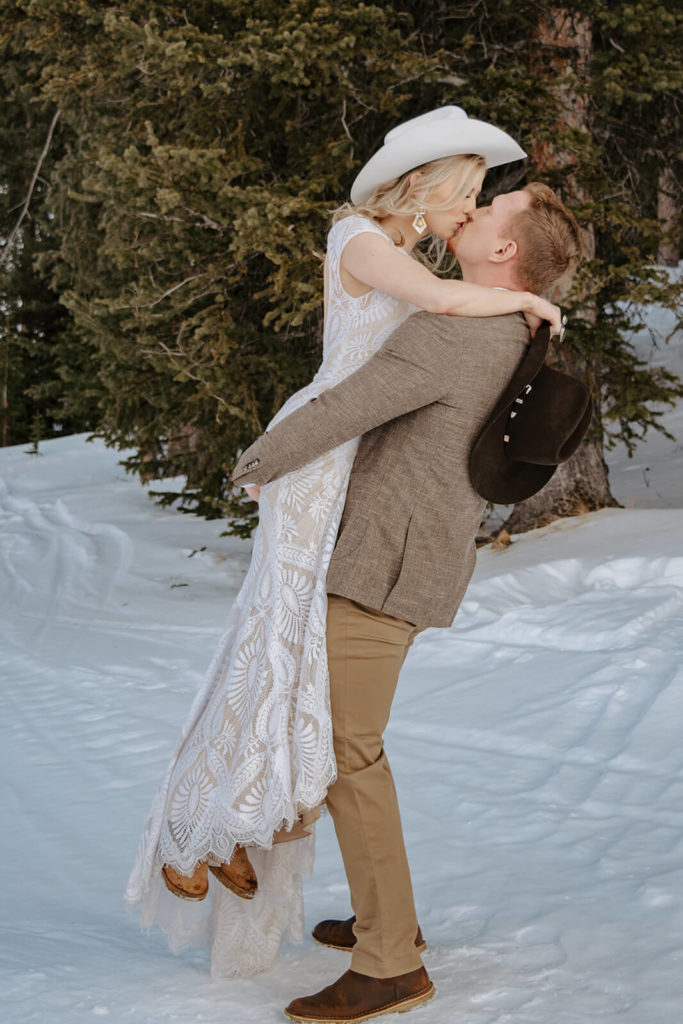 Bride and Groom Kiss Wyoming Winter Wedding