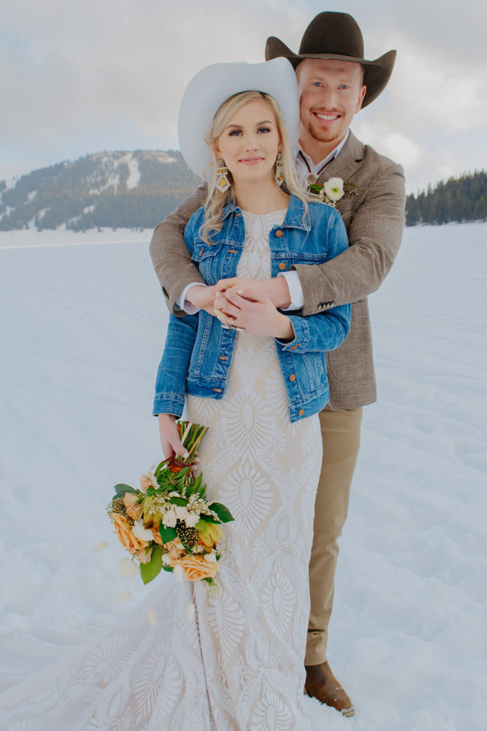 Bride and Groom with Snowy Mountains in Background