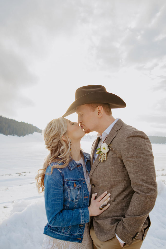 Sunset Kiss During Snowy Wedding