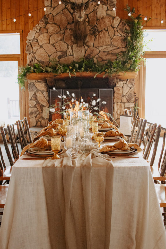 winter wedding cozy table setting with fireplace
