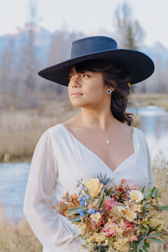 Bride in cowboy hat at Antelope Trails Ranch wedding venue Jackson Hole, wyoming