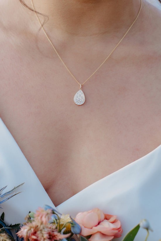 Bride wearing necklace from JC Jewlers in Jackson Hole, Wyoming