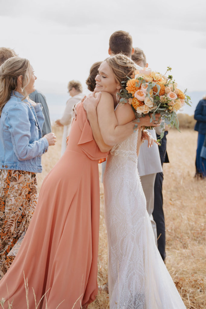Vanessa Hugs Bridesmaid After Ceremony in Jackson Hole, Wyoming