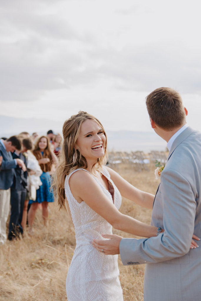 Vanessa Smiles at Camera after wedding ceremony at SHadow Mountain