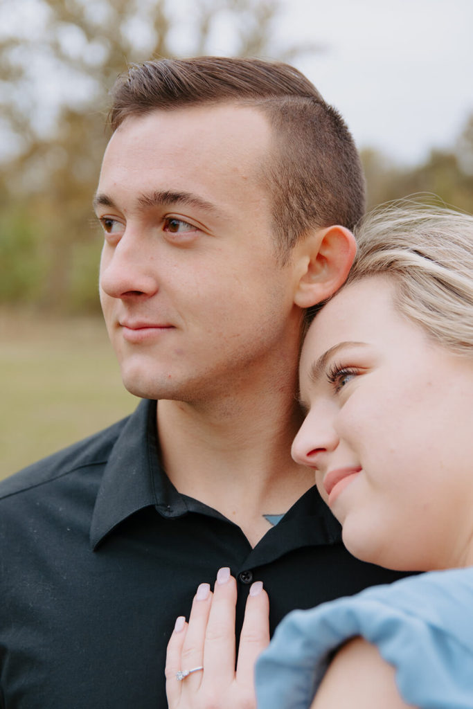 Couple Looks Into Distance During Oklahoma Photoshoot