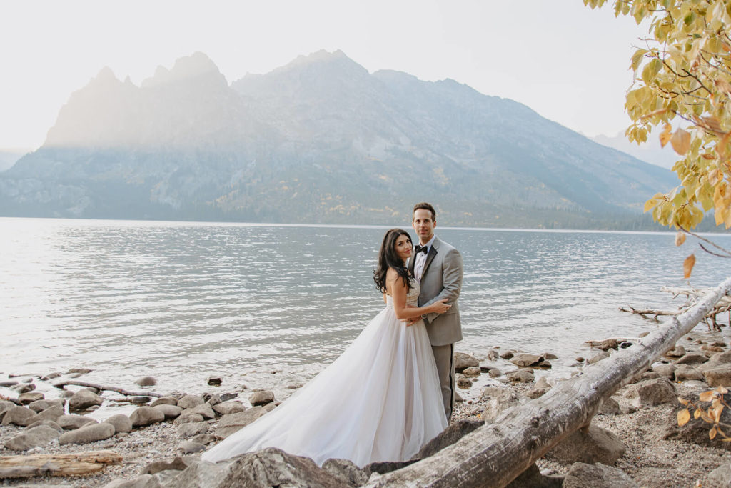 Elopement Portrait with Lake by Teton Mountains in Wyoming