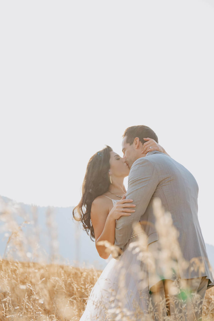 Sunny Photo of Rachel and Clay Kissing During Wyoming Elopement