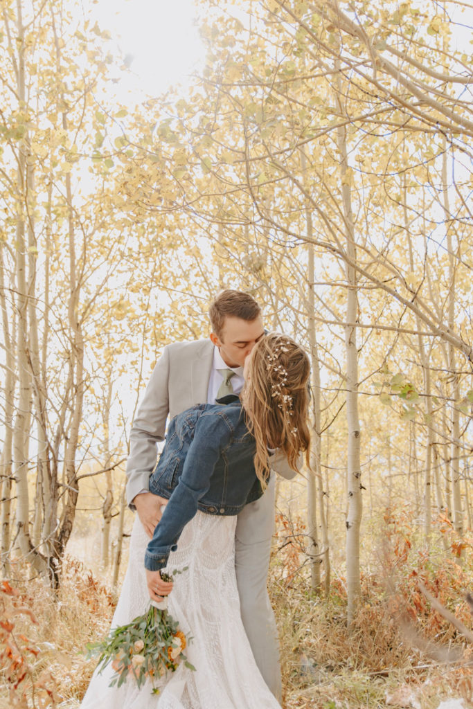 Bride and Groom Kiss in Jackson Hole Wyoming Forest