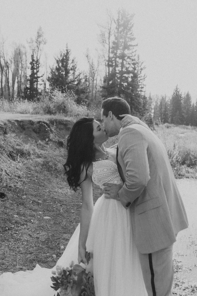 Black and White Photo of Couple Kissing During Destination Elopement