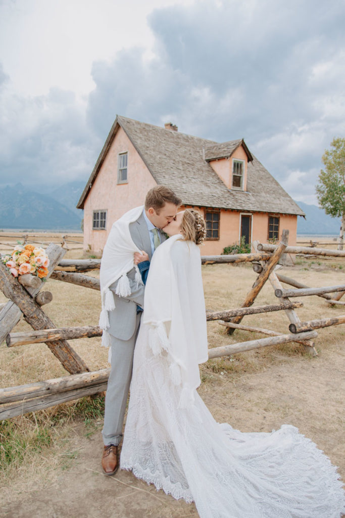 Bride and Groom Kissing With Wyoming Background