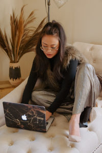 Great Social Club founder works on computer during her branding session