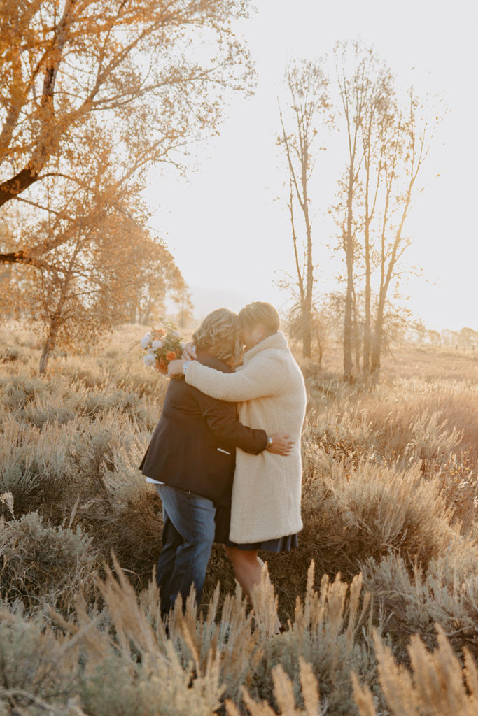 Jackson Hole elopement in Grand teton national park at sunrise with two brides
