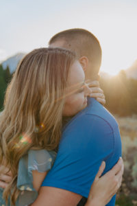 Gorgeous, natural light engagement photo with Ariane and Jackson at Dusk as sunsets behind them