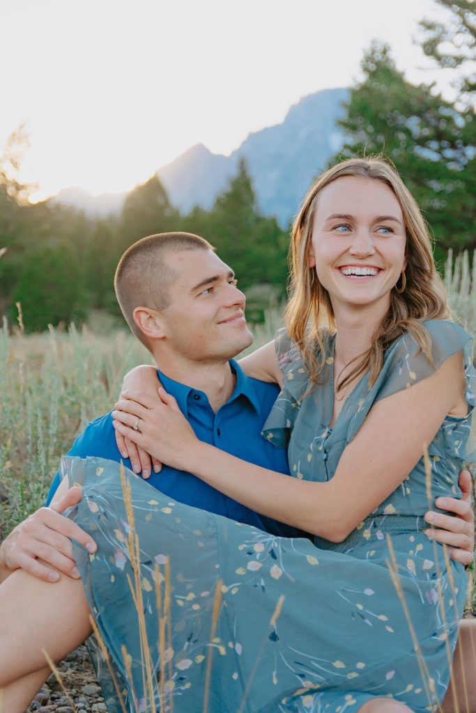 Gorgeous, dim lit engagement photo with Ariane and Jackson in a beautiful field