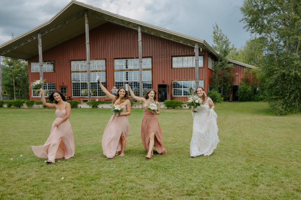 Bridal party in neutrals with the bride at Diamond Cross ranch. 