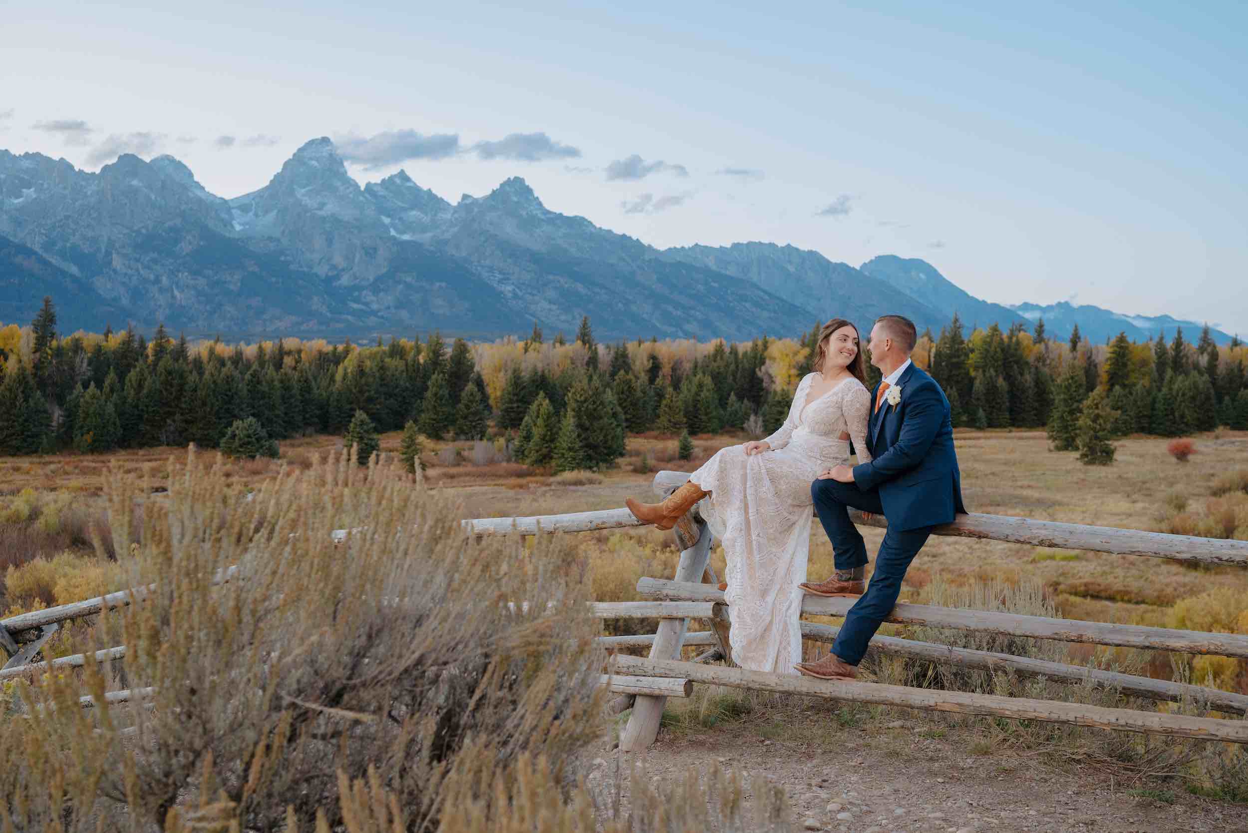 Grand Teton National Park Elopement: Alyssa and Tim share a tender moment with stunning panoramic views as their backdrop.