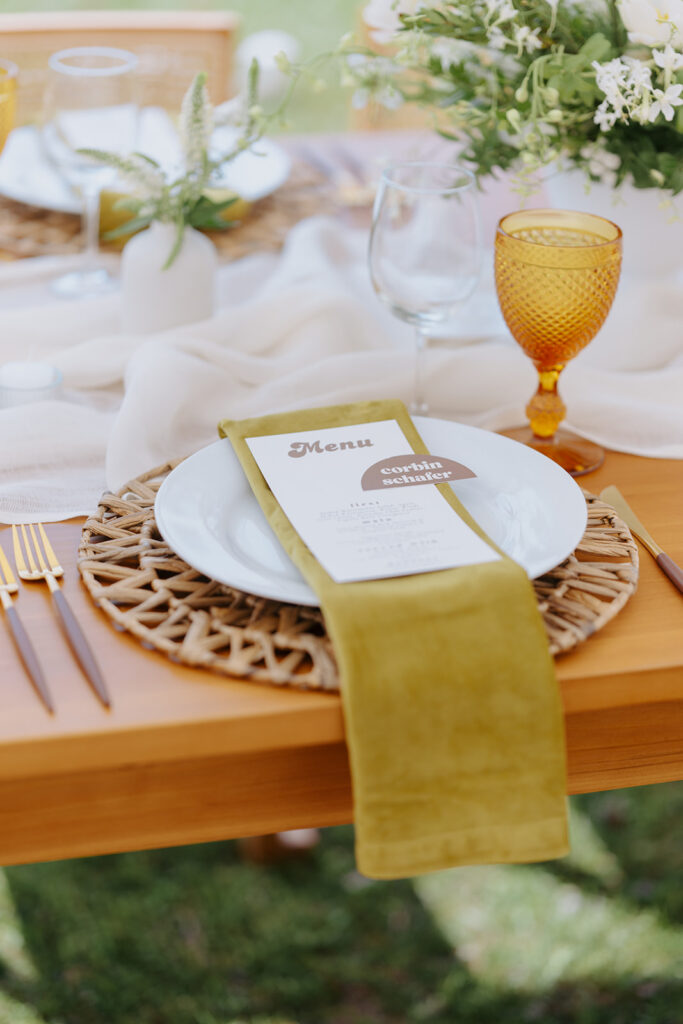 Wedding reception table with velvet napkin and retro-chic style