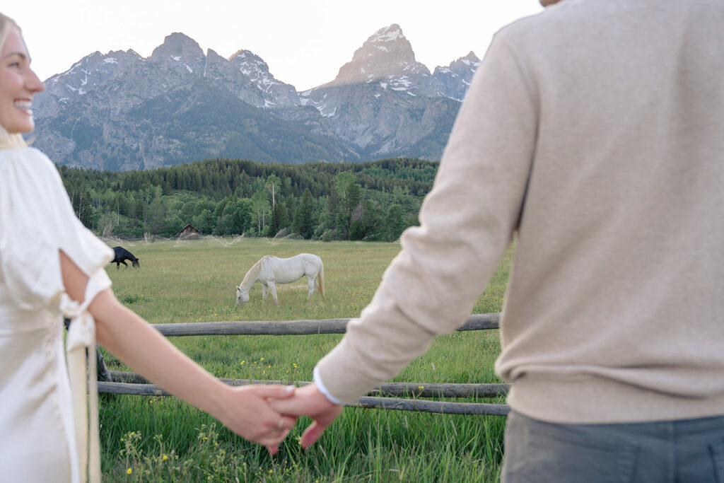 Jackson Hole Engagement photography with horses and mountains