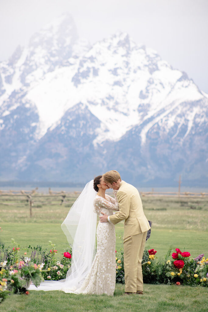 Couple kisses at Lost Creek ranch Wedding Ceremony